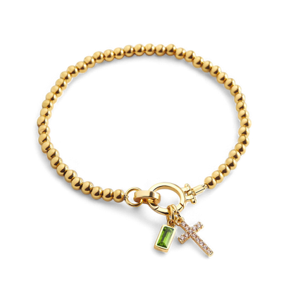 Pulsera con charm de cruz y piedra de nacimiento