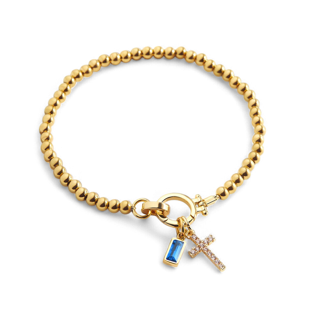 Pulsera con charm de cruz y piedra de nacimiento