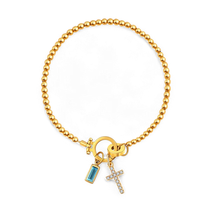 Pulsera con charm de cruz y piedra de nacimiento