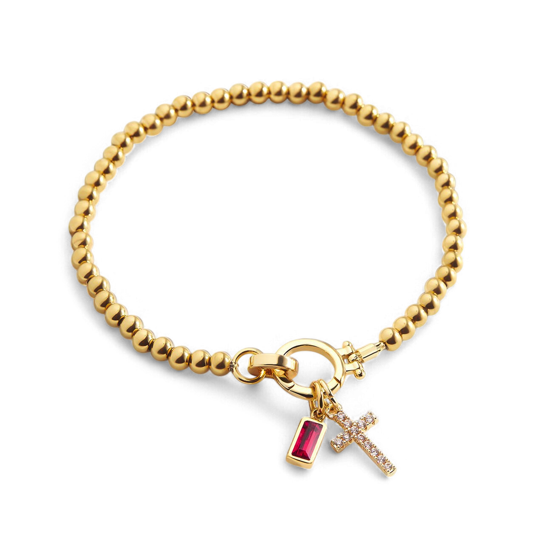 Pulsera con charm de cruz y piedra de nacimiento