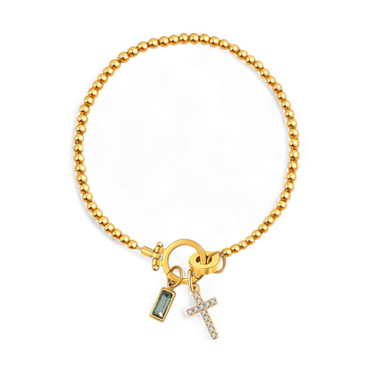 Pulsera con charm de cruz y piedra de nacimiento
