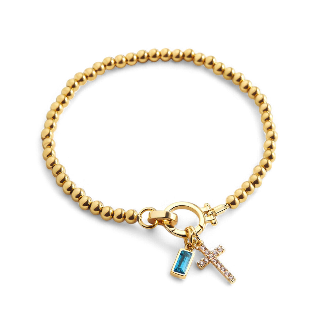 Pulsera con charm de cruz y piedra de nacimiento