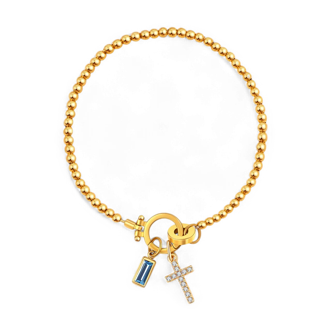 Pulsera con charm de cruz y piedra de nacimiento
