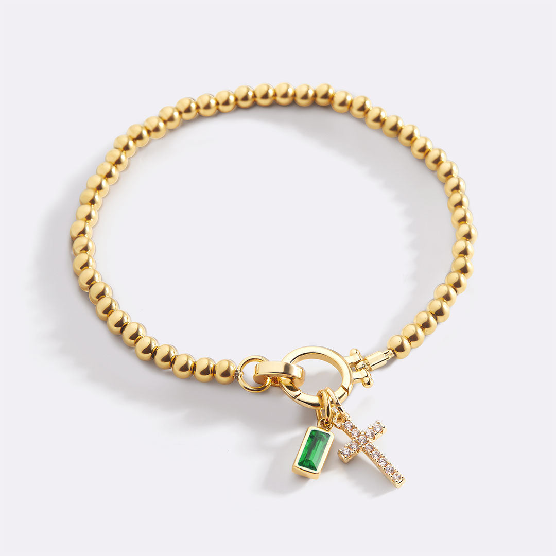 Pulsera con charm de cruz y piedra de nacimiento