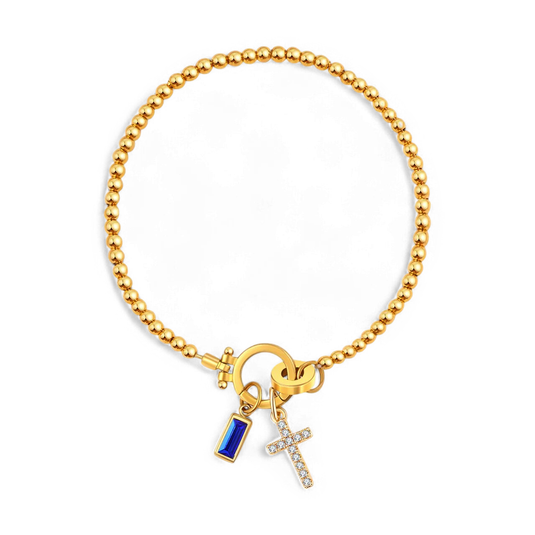 Pulsera con charm de cruz y piedra de nacimiento