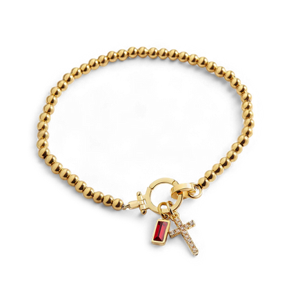 Pulsera con charm de cruz y piedra de nacimiento