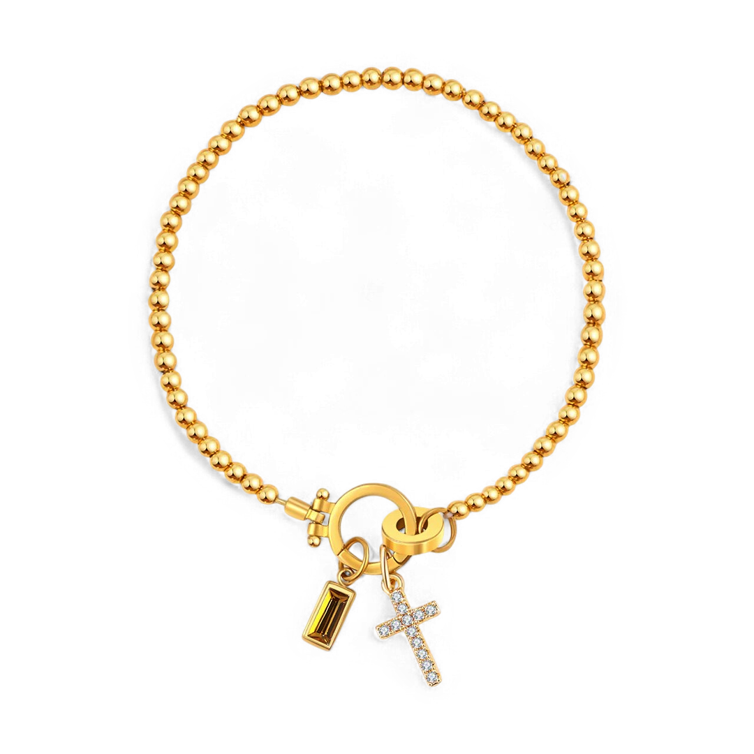Pulsera con charm de cruz y piedra de nacimiento