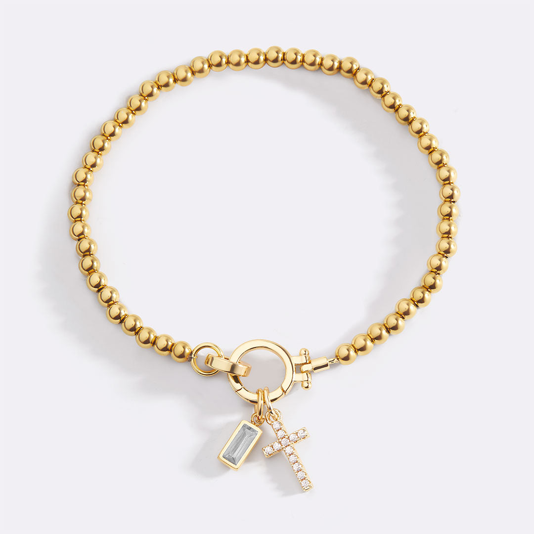 Pulsera con charm de cruz y piedra de nacimiento