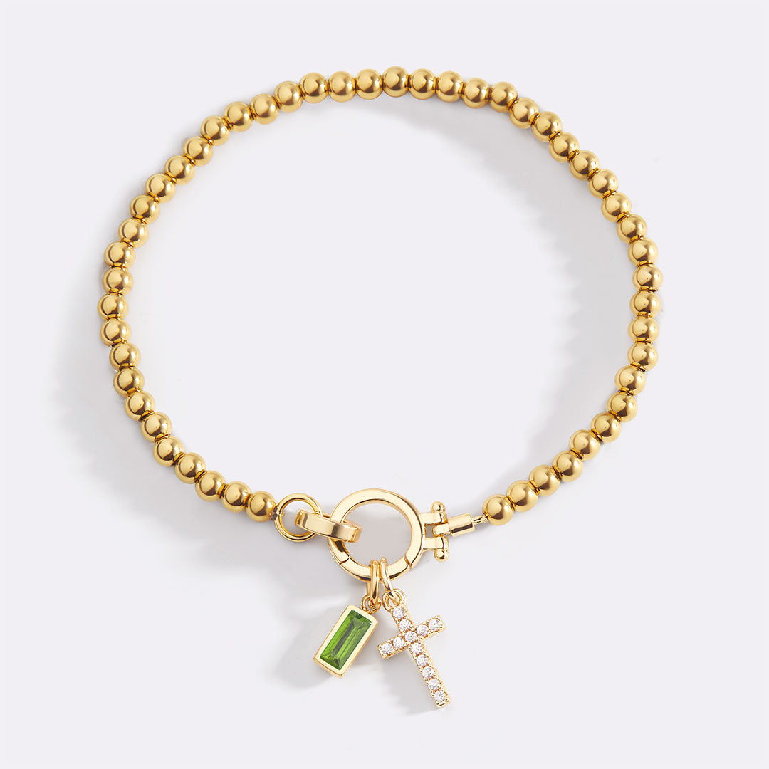 Pulsera con charm de cruz y piedra de nacimiento