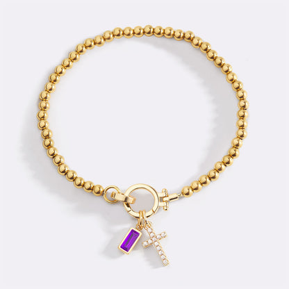 Pulsera con charm de cruz y piedra de nacimiento