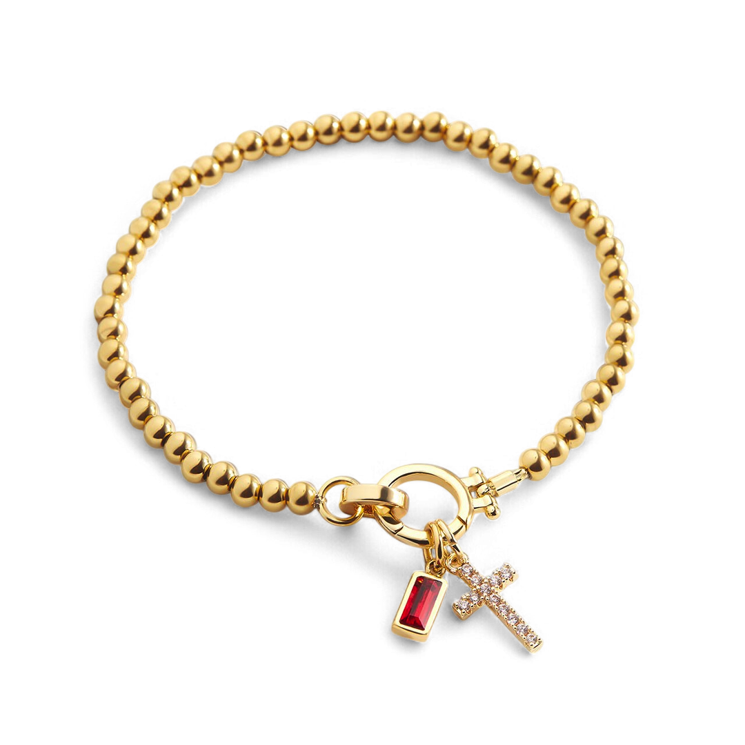 Pulsera con charm de cruz y piedra de nacimiento