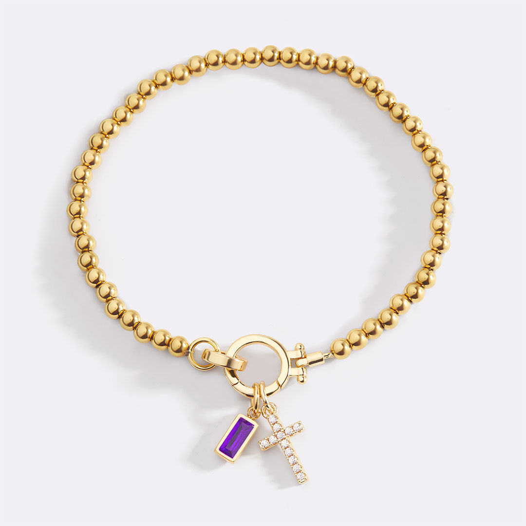 Pulsera con charm de cruz y piedra de nacimiento