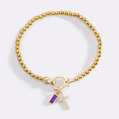 Pulsera con charm de cruz y piedra de nacimiento