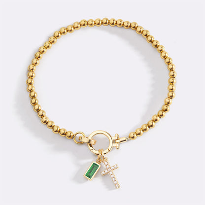 Pulsera con charm de cruz y piedra de nacimiento