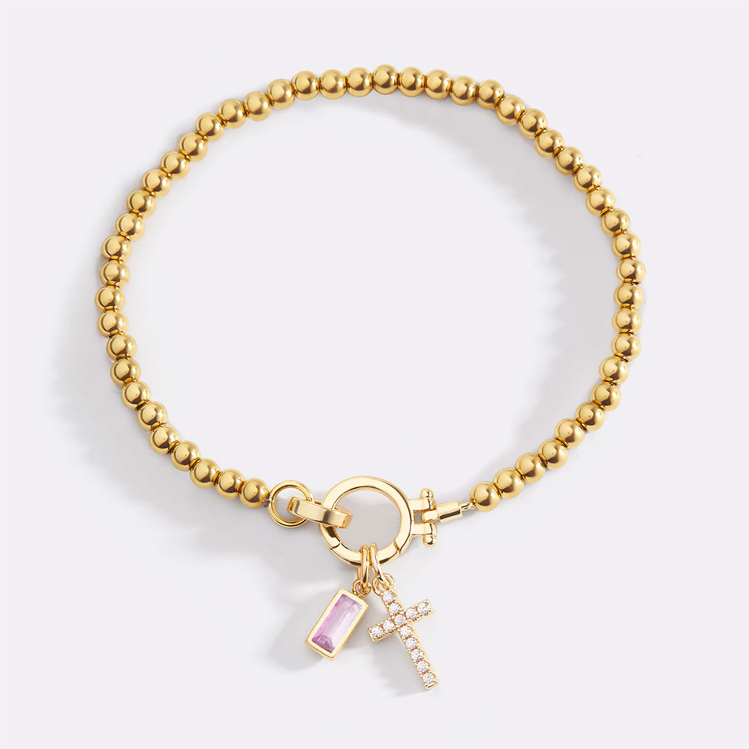 Pulsera con charm de cruz y piedra de nacimiento