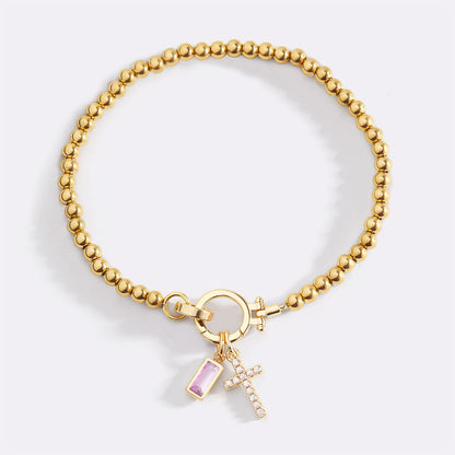Pulsera con charm de cruz y piedra de nacimiento