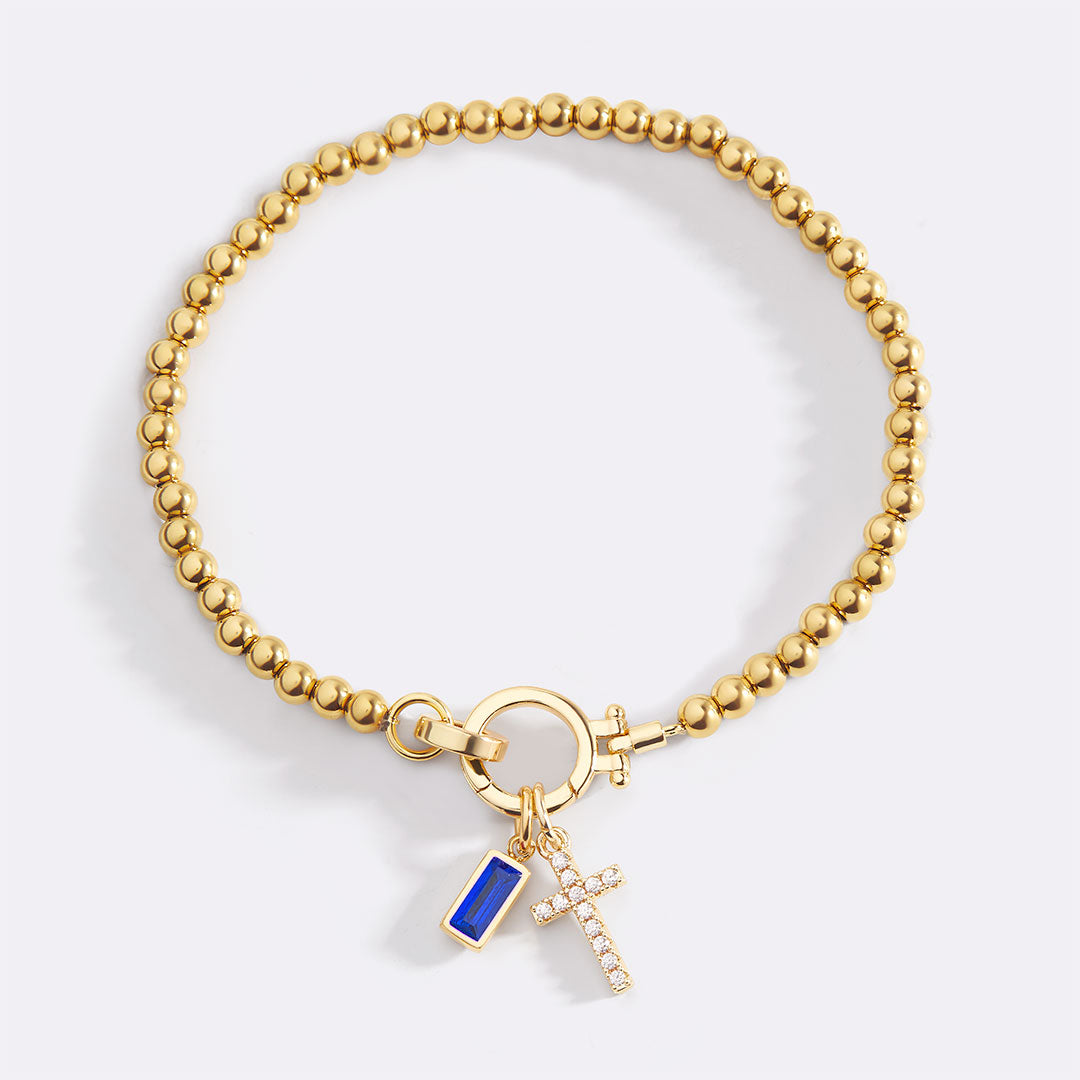 Pulsera con charm de cruz y piedra de nacimiento