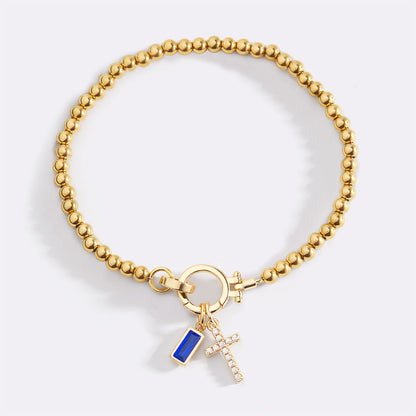 Pulsera con charm de cruz y piedra de nacimiento