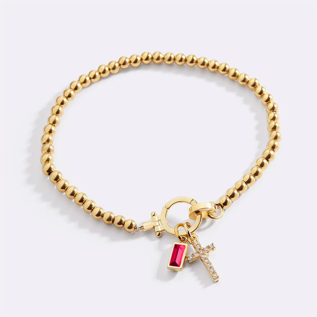 Pulsera con charm de cruz y piedra de nacimiento