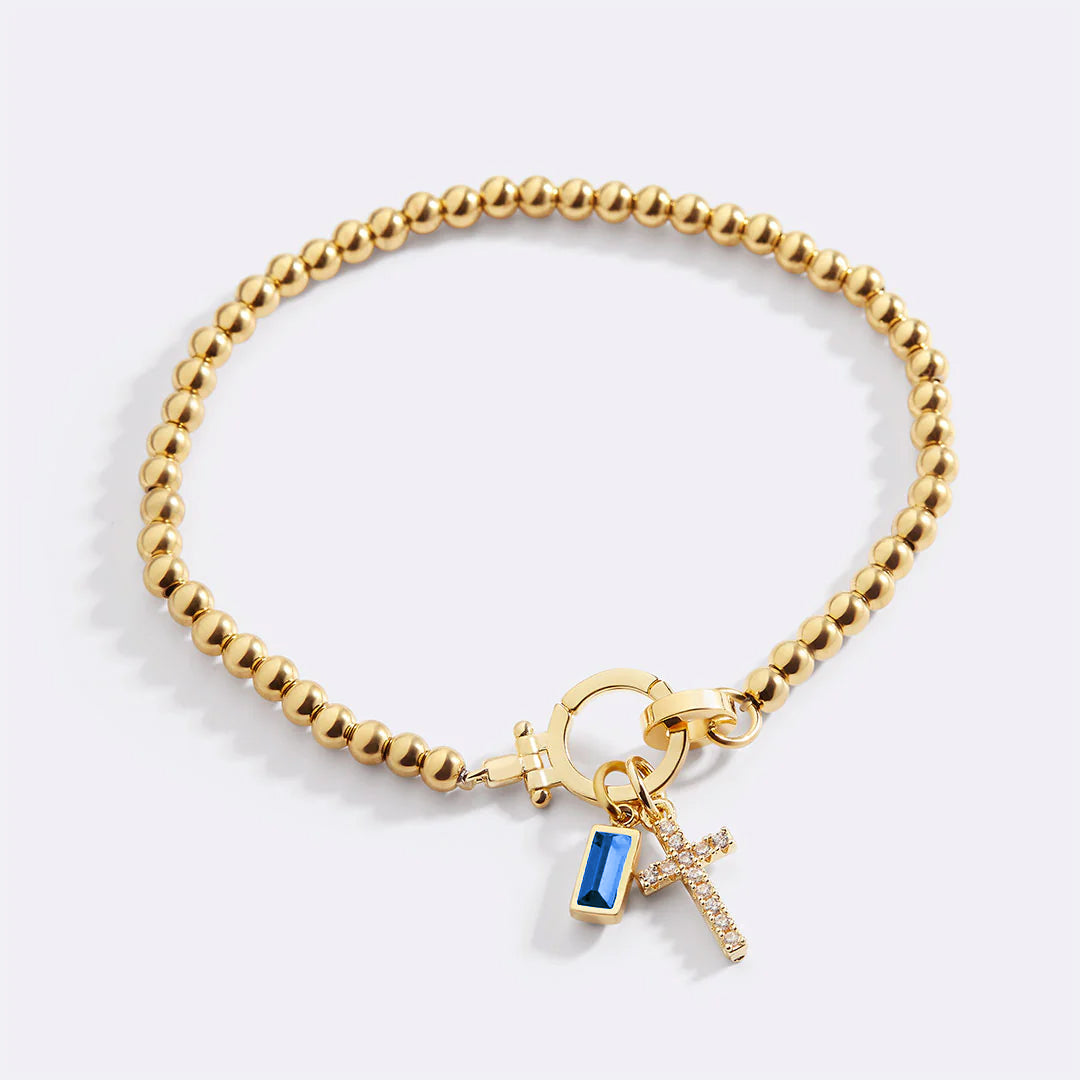Pulsera con charm de cruz y piedra de nacimiento